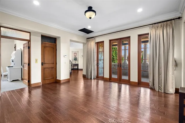 a view of an entryway with wooden floors