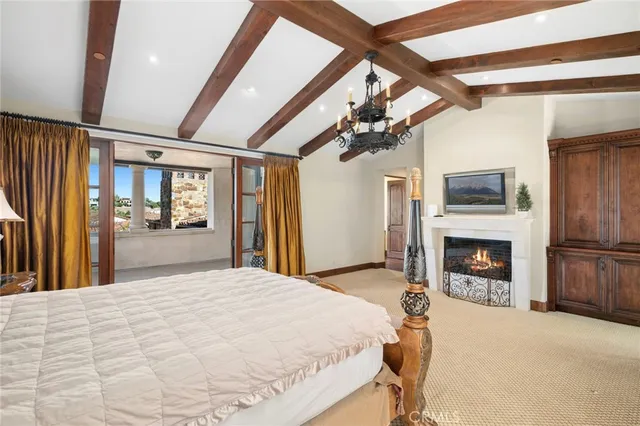 a bedroom with a bed and a fireplace