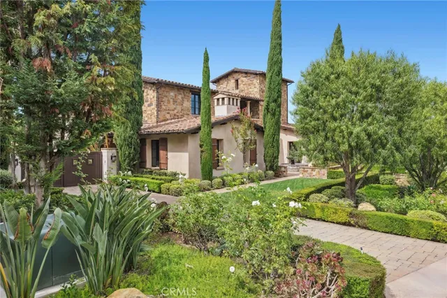 a view of a brick building next to a yard