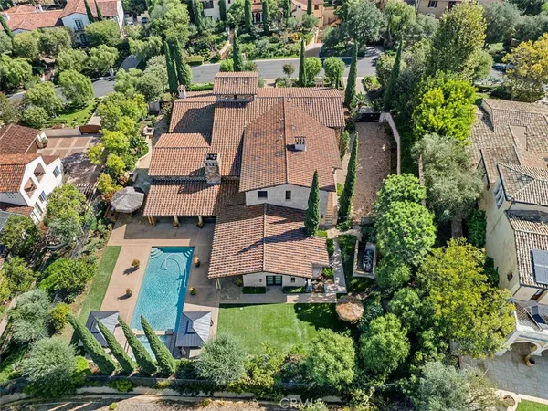 an aerial view of multiple houses with yard
