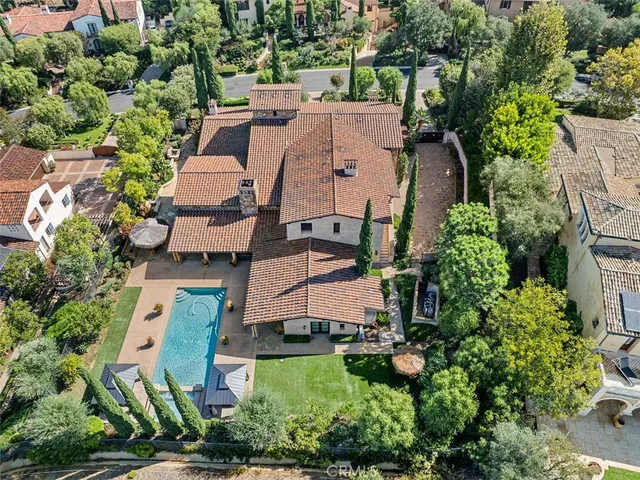 an aerial view of multiple houses with yard