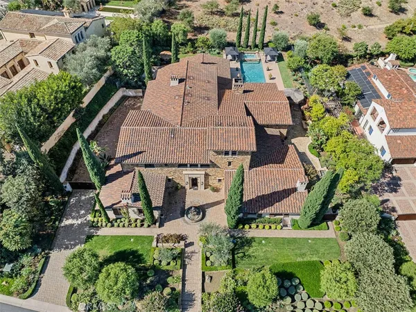an aerial view of multiple houses with yard