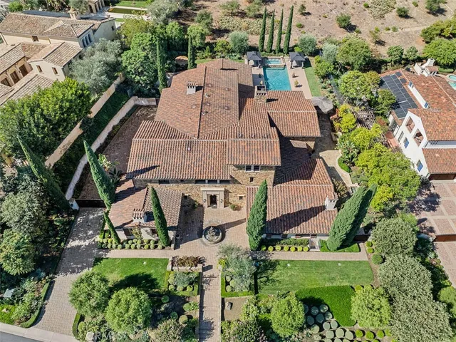 an aerial view of multiple houses with yard