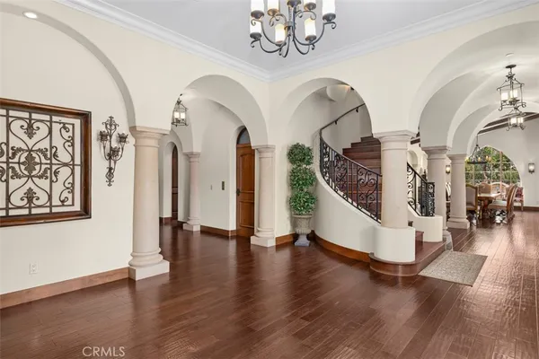 a view of an entryway with wooden floor