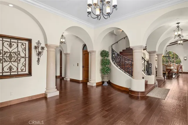 a view of an entryway with wooden floor