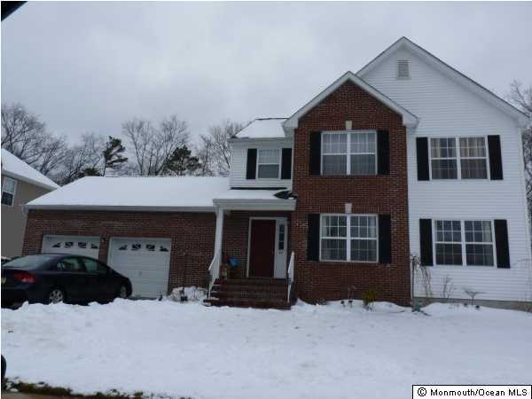 11 Rutgers Drive Howell, NJ 07731 - Photo 1 of 3 a front view of a house with a yard