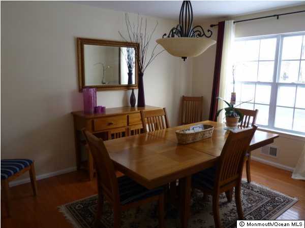 11 Rutgers Drive Howell, NJ 07731 - Photo 3 of 3 a view of a dining room with a table and chairs