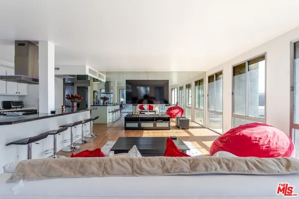 a living room with furniture fireplace and a flat screen tv