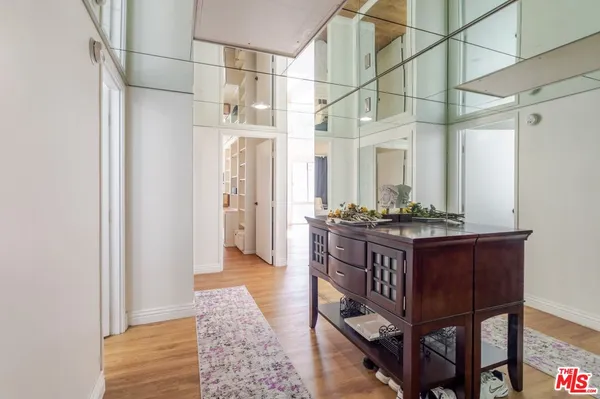 a bathroom with a tub shower and sink