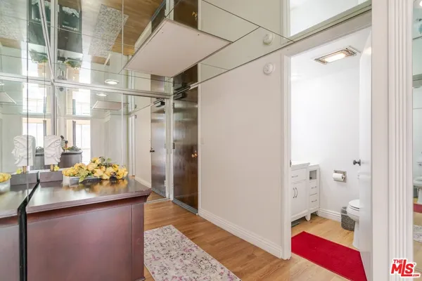 a bedroom with a large bed and a large window