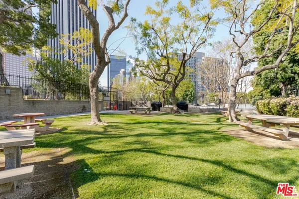 a view of outdoor space swimming pool and trees in the background