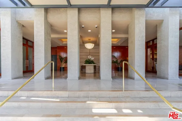 a view hallway with living room and dining room