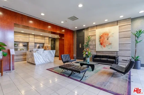 a living room with lots of furniture and a flat screen tv
