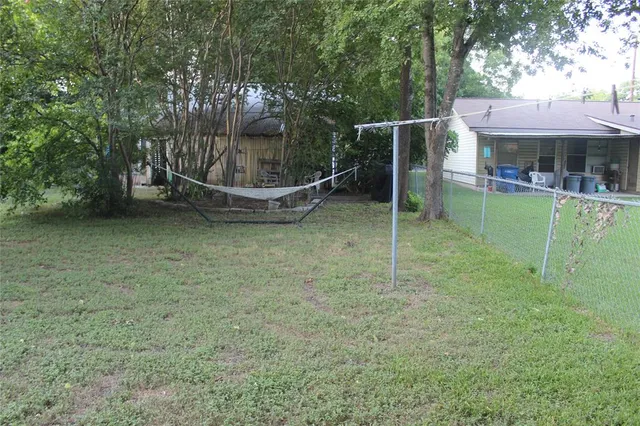 a view of a wooden deck with a yard