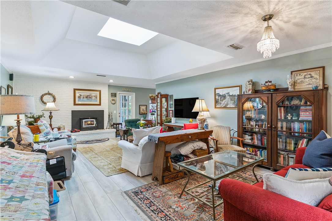 219 Five Pounds Road St. Simons Island, GA 31522 - Photo 8 of 29 Light & bright living room with wood stove insert