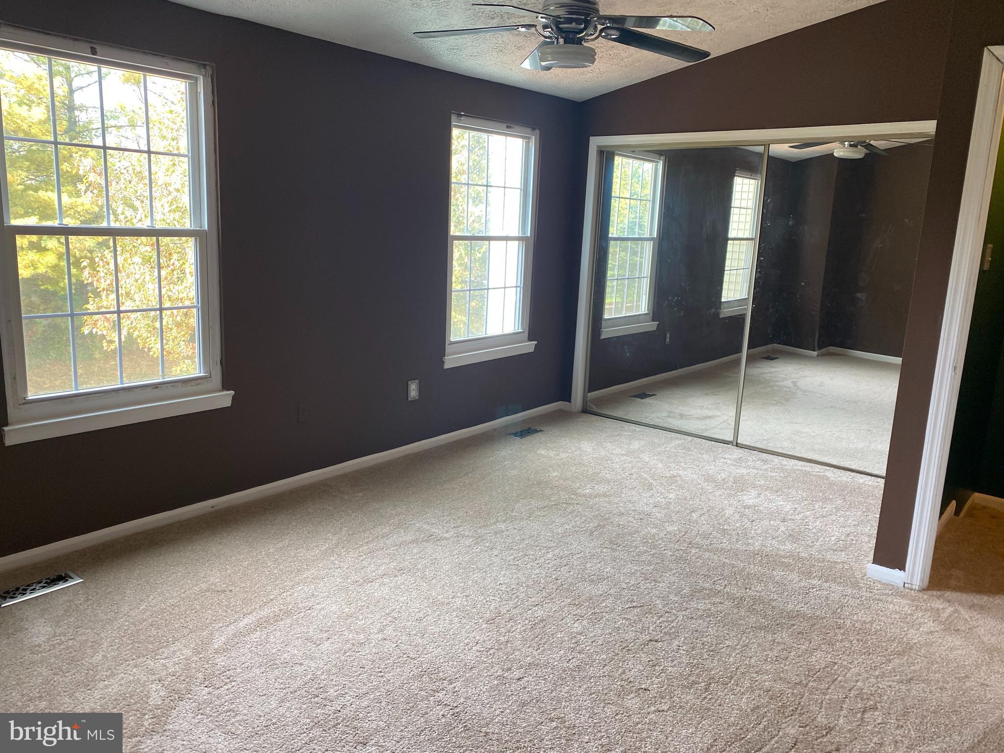 35 Cavan Green Baltimore, MD 21236 - Photo 7 of 16 a view of an empty room with glass door and windows