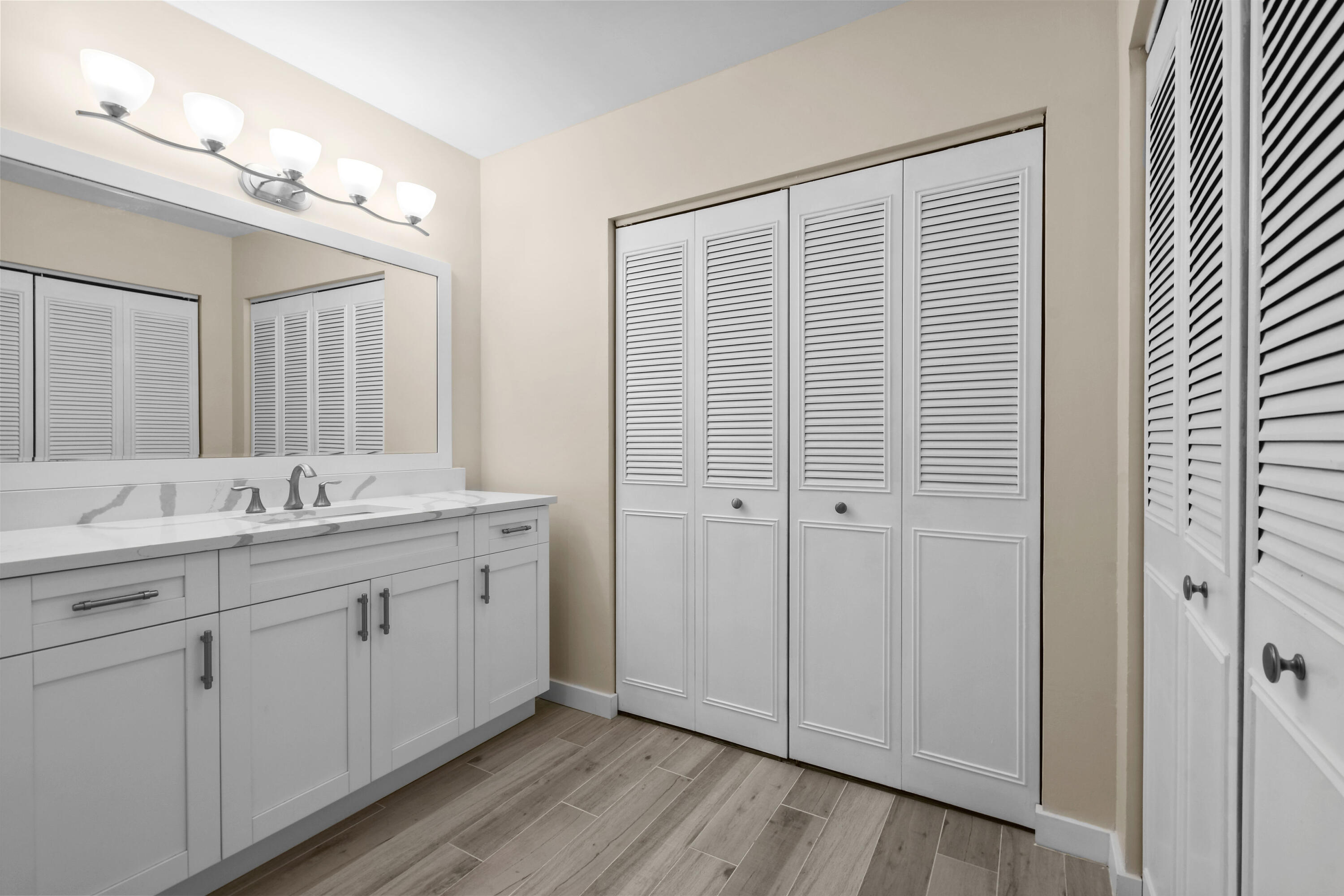 3540 South Ocean Boulevard, Unit 611 South Palm Beach, FL 33480 - Photo 11 of 27 a bathroom with a double vanity sink and mirror