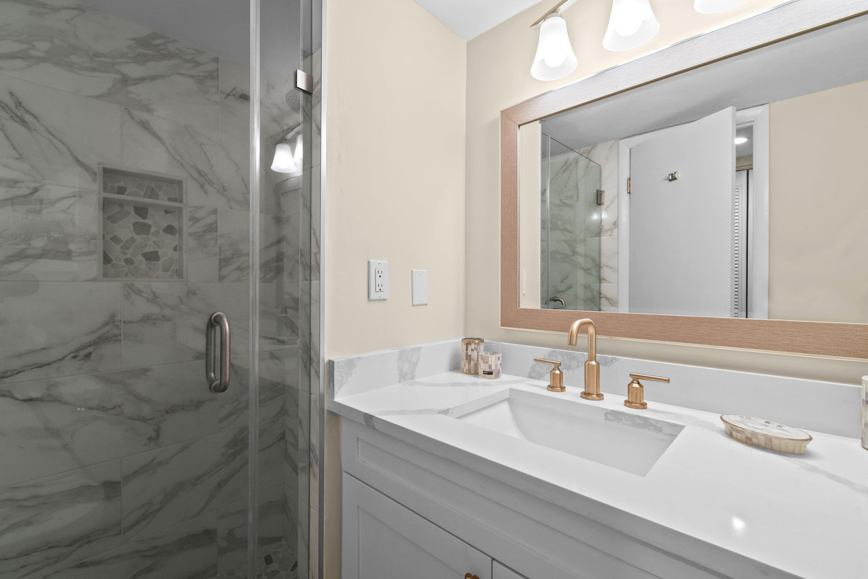 3540 South Ocean Boulevard, Unit 611 South Palm Beach, FL 33480 - Photo 14 of 27 a bathroom with a sink and a mirror