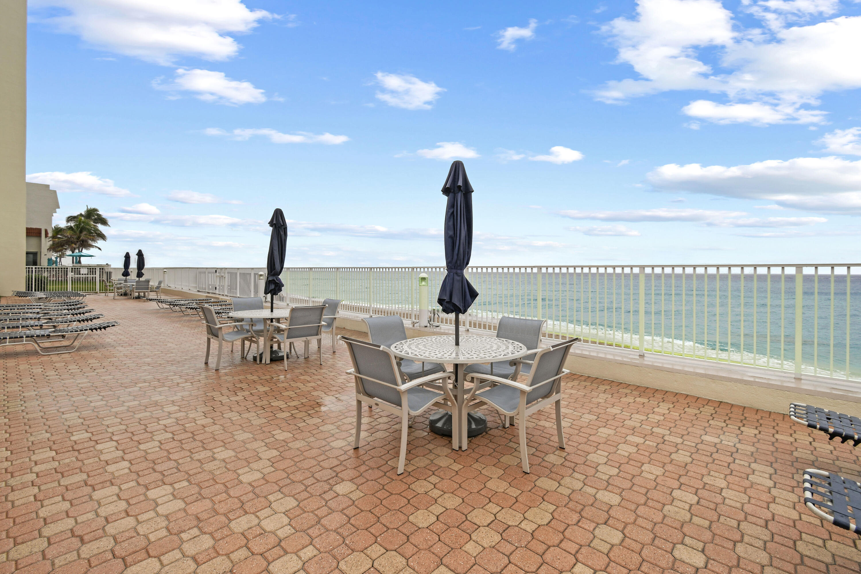 3540 South Ocean Boulevard, Unit 611 South Palm Beach, FL 33480 - Photo 18 of 27 a view of a terrace with furniture