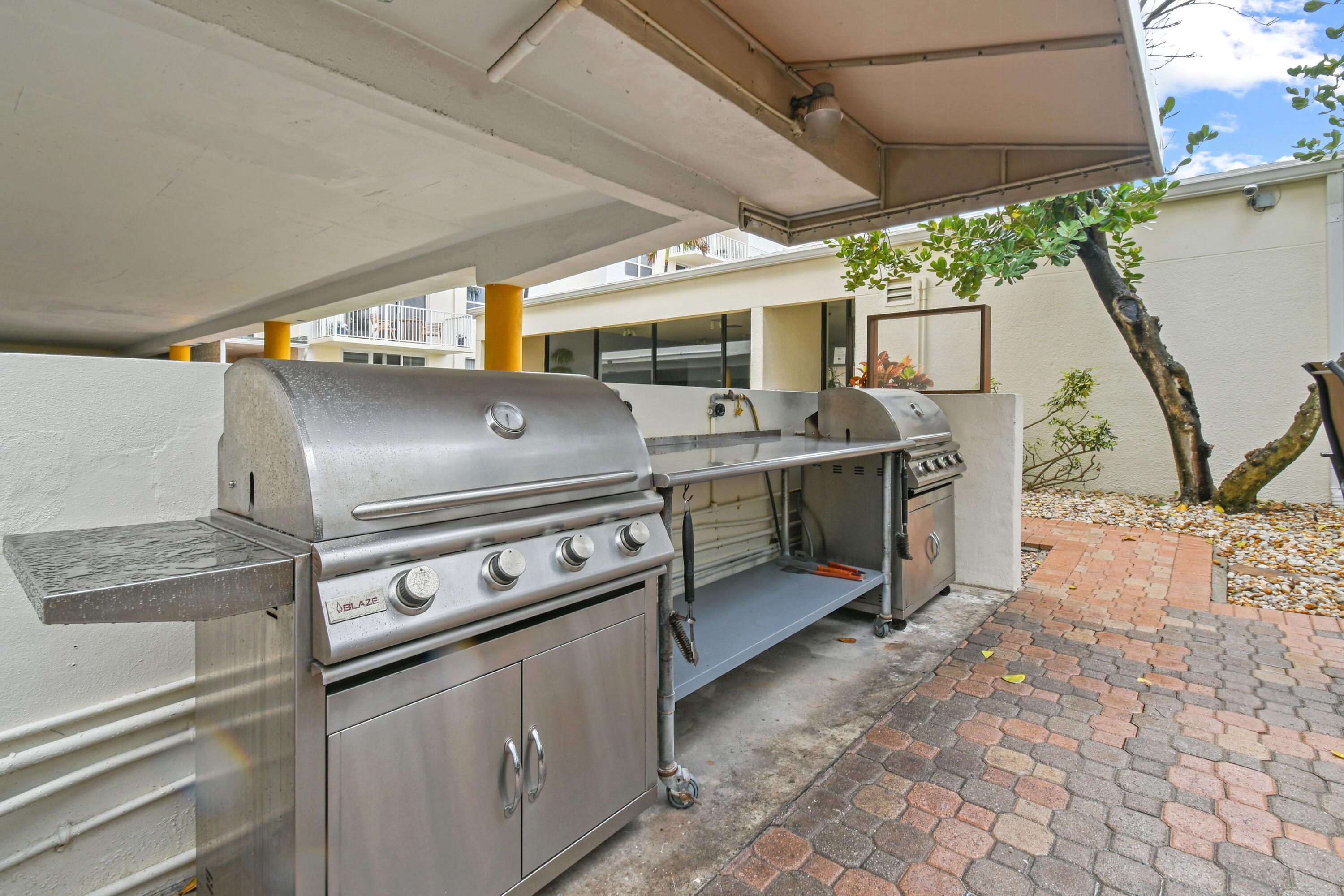 3540 South Ocean Boulevard, Unit 611 South Palm Beach, FL 33480 - Photo 19 of 27 a view of a kitchen with a stove top oven and a table