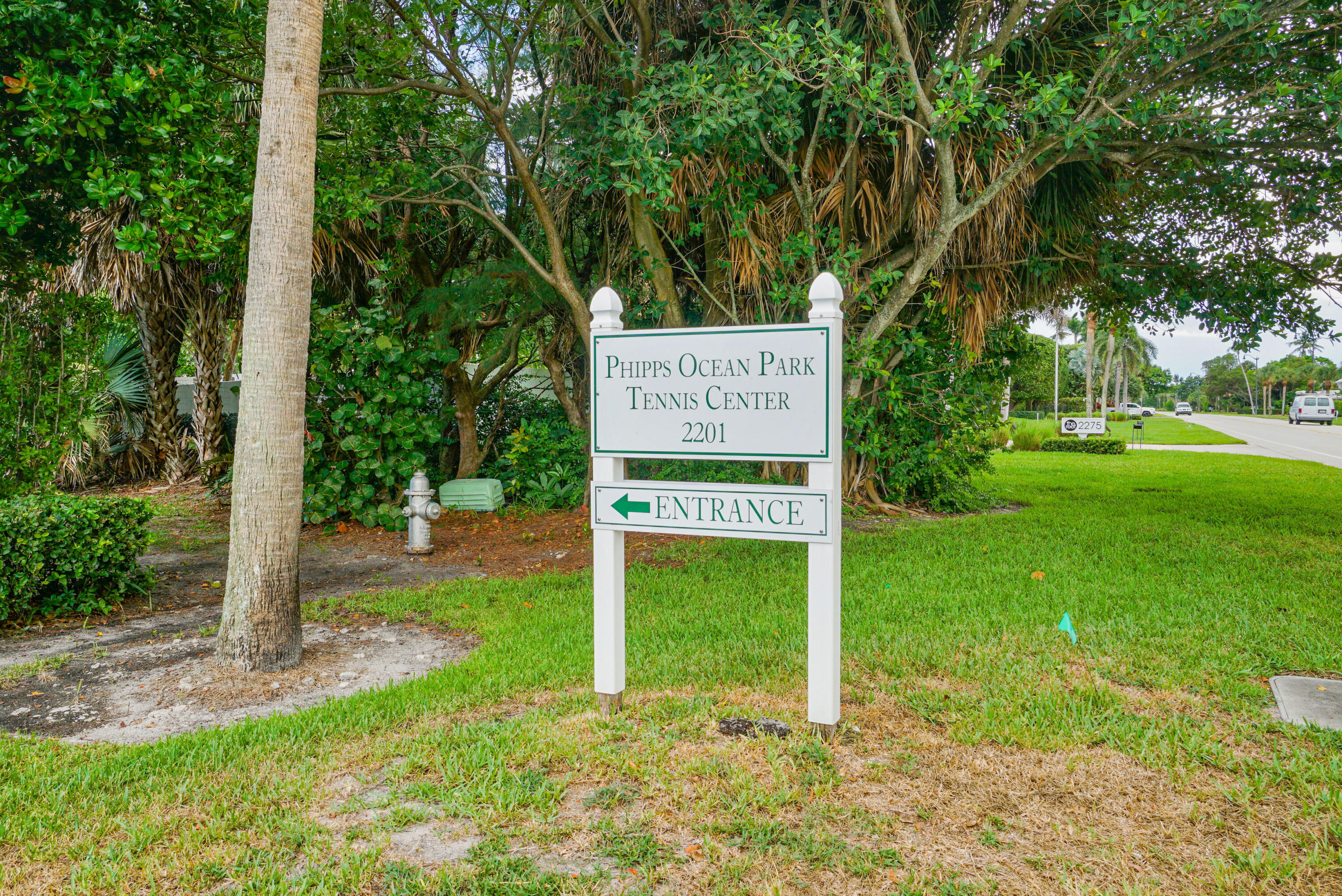 3540 South Ocean Boulevard, Unit 611 South Palm Beach, FL 33480 - Photo 23 of 27 a sign that is sitting in front of a tree