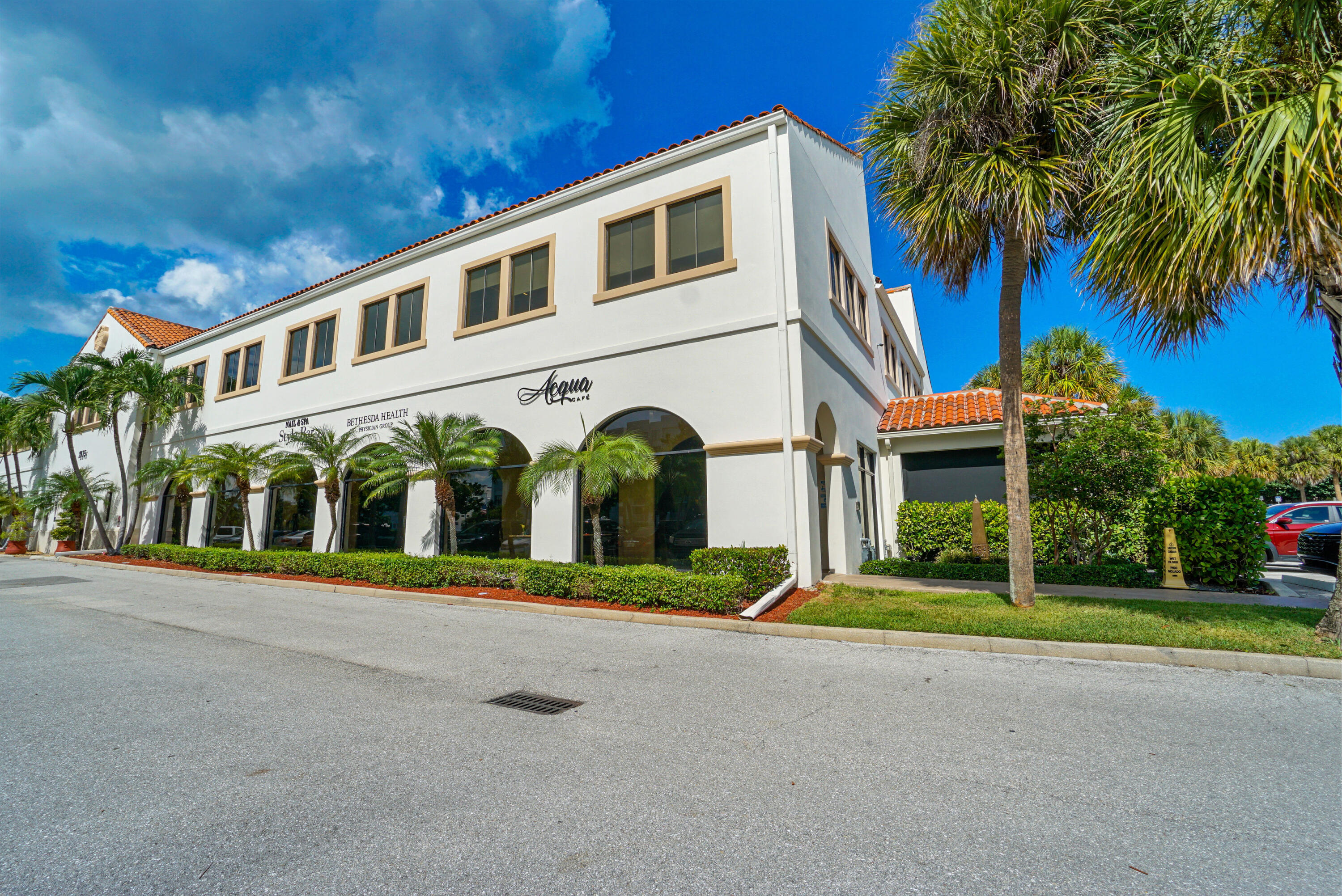 3540 South Ocean Boulevard, Unit 611 South Palm Beach, FL 33480 - Photo 24 of 27 a front view of a building with garden and trees