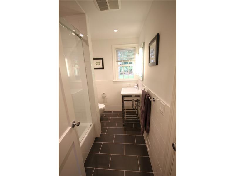 6 Little Brook Road Rowayton, CT 06853 - Photo 11 of 23 a bathroom with a sink and a mirror
