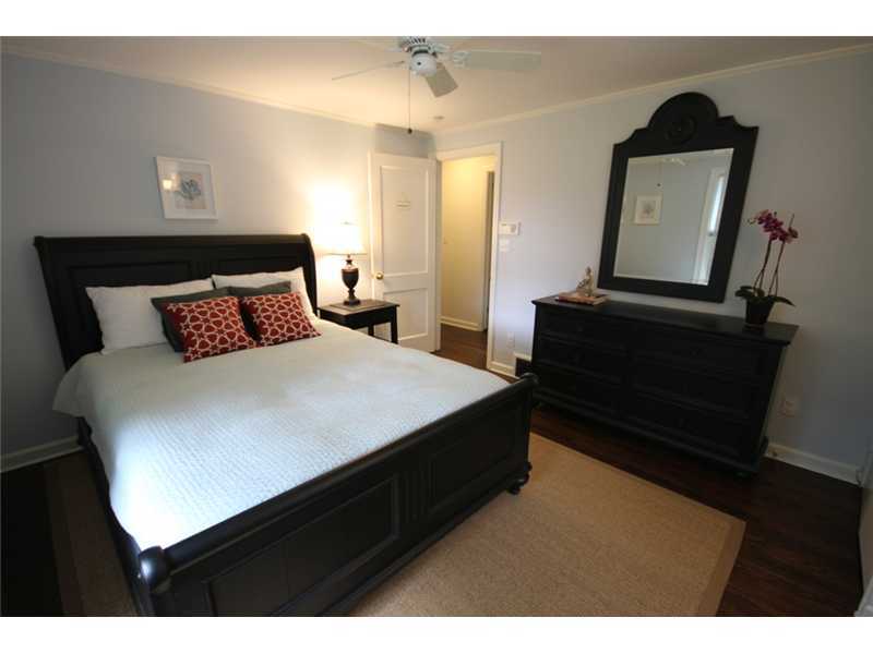 6 Little Brook Road Rowayton, CT 06853 - Photo 13 of 23 a bedroom with a bed and a mirror