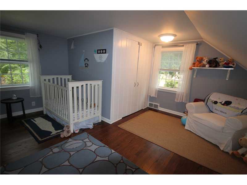 6 Little Brook Road Rowayton, CT 06853 - Photo 16 of 23 a bedroom with a bed and a window