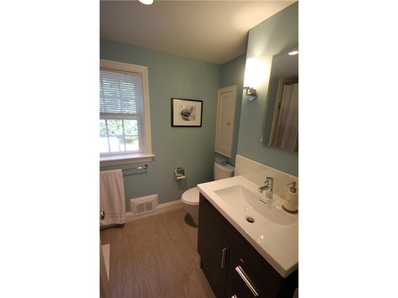 6 Little Brook Road Rowayton, CT 06853 - Photo 17 of 23 a bathroom with a sink a toilet and a mirror