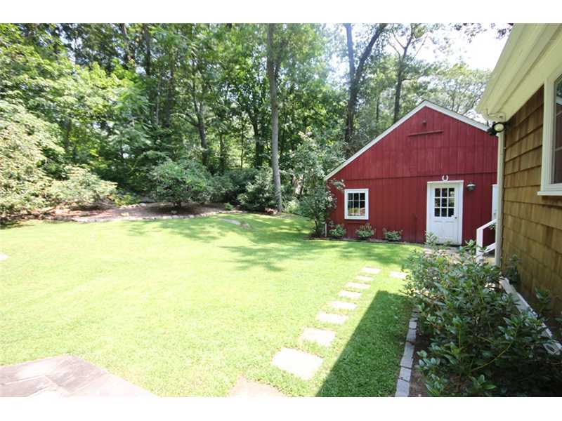 6 Little Brook Road Rowayton, CT 06853 - Photo 21 of 23 a view of a house with a backyard