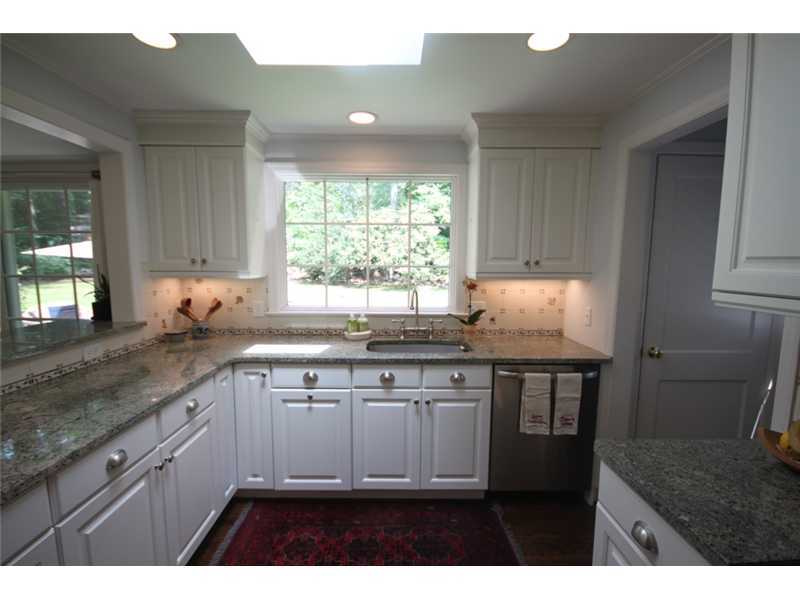 6 Little Brook Road Rowayton, CT 06853 - Photo 9 of 23 a kitchen with granite countertop a sink cabinets and window