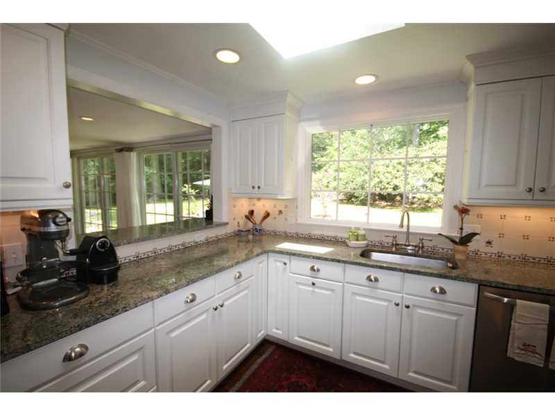 6 Little Brook Road Rowayton, CT 06853 - Photo 10 of 23 a kitchen with a sink a window and cabinets