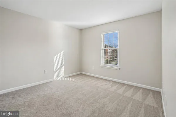 a view of a workspace with furniture and a potted plant
