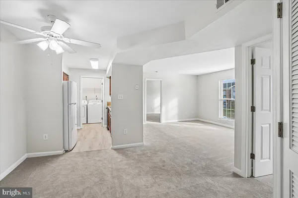 a living room with furniture a rug and a table