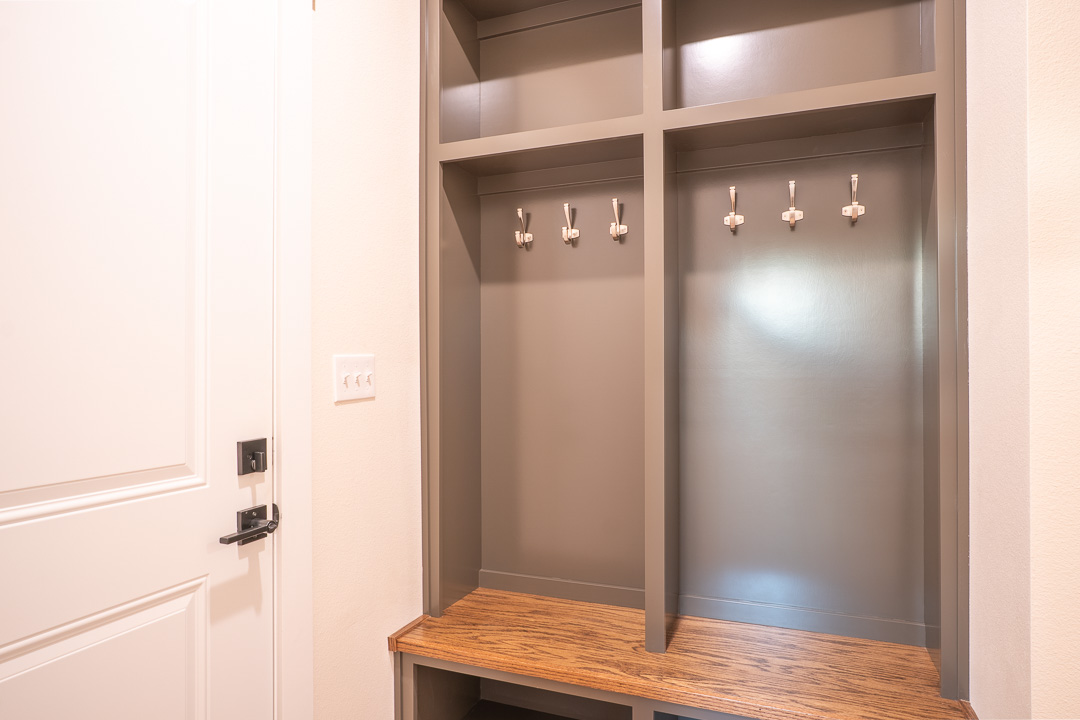 205 Blessings Way Colbert, OK 74733 - Photo 23 of 24 Built-in hall tree with wood-finish bench, integrated storage cubbies, and coat hooks