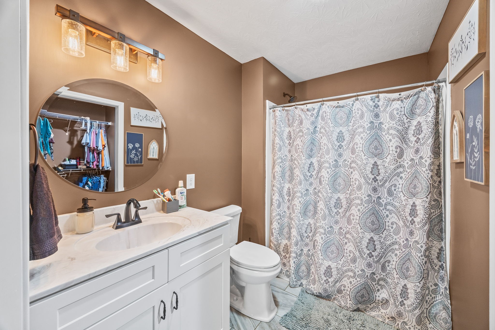 13723 Old Kentucky Road Walling, TN 38587 - Photo 11 of 34 a bathroom with a sink a toilet and a mirror