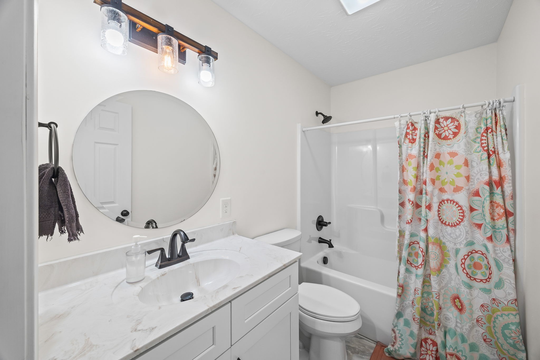 13723 Old Kentucky Road Walling, TN 38587 - Photo 18 of 34 a bathroom with a sink toilet and shower