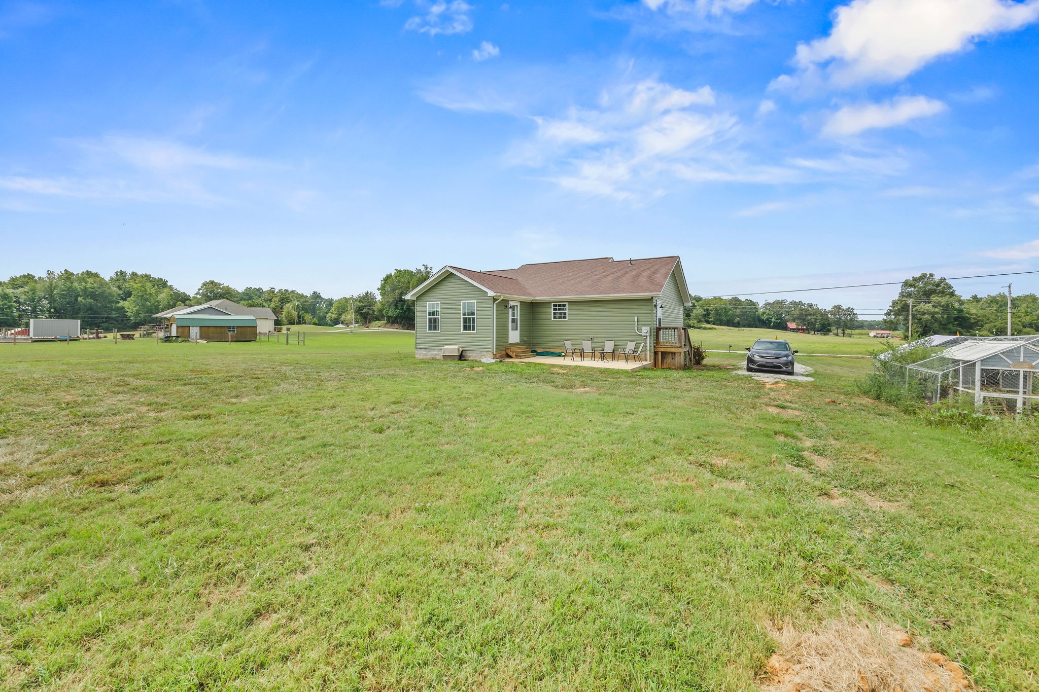 13723 Old Kentucky Road Walling, TN 38587 - Photo 21 of 34 a backyard of a house with table and chairs