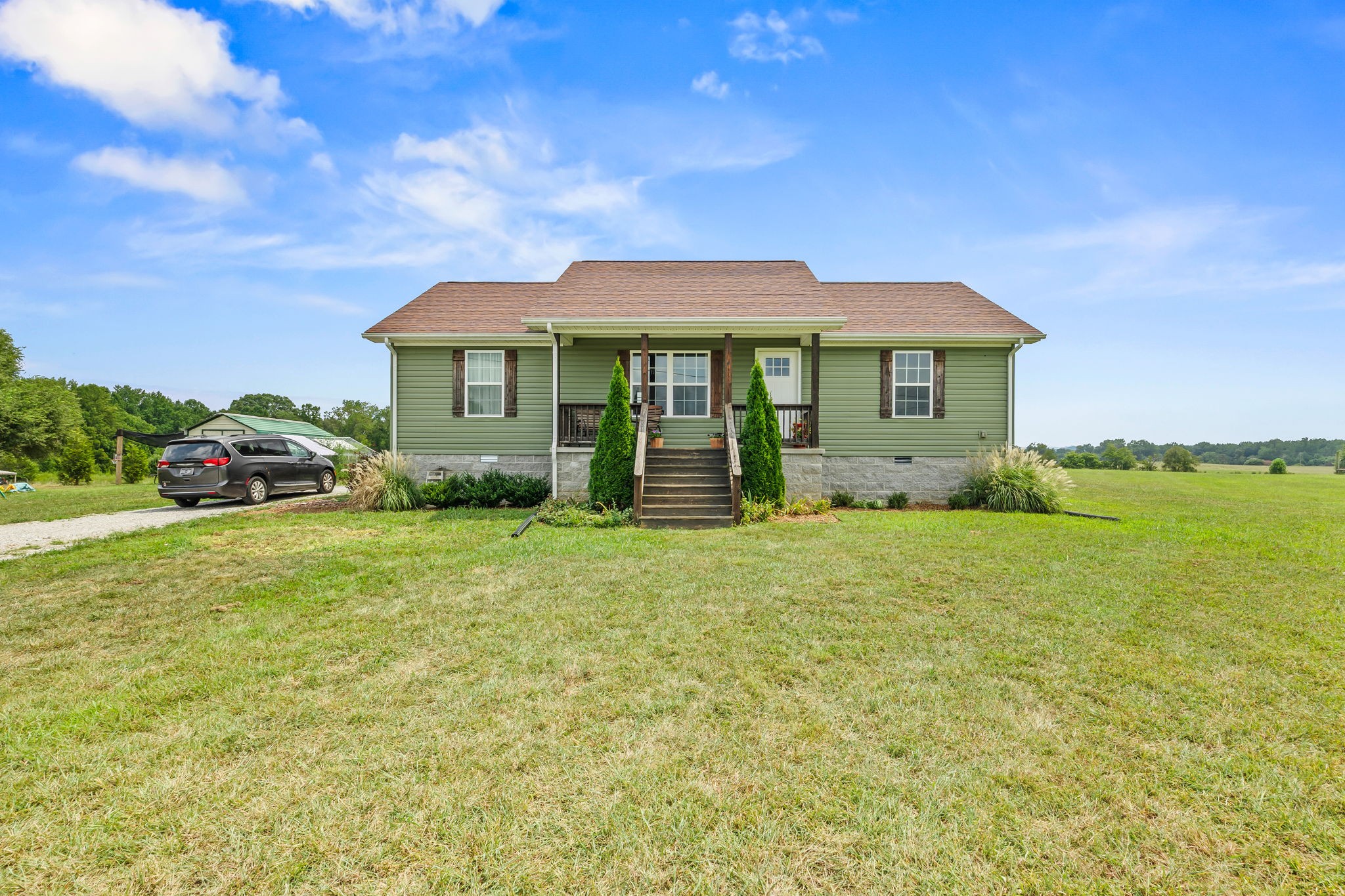 13723 Old Kentucky Road Walling, TN 38587 - Photo 24 of 34 a front view of a house with garden