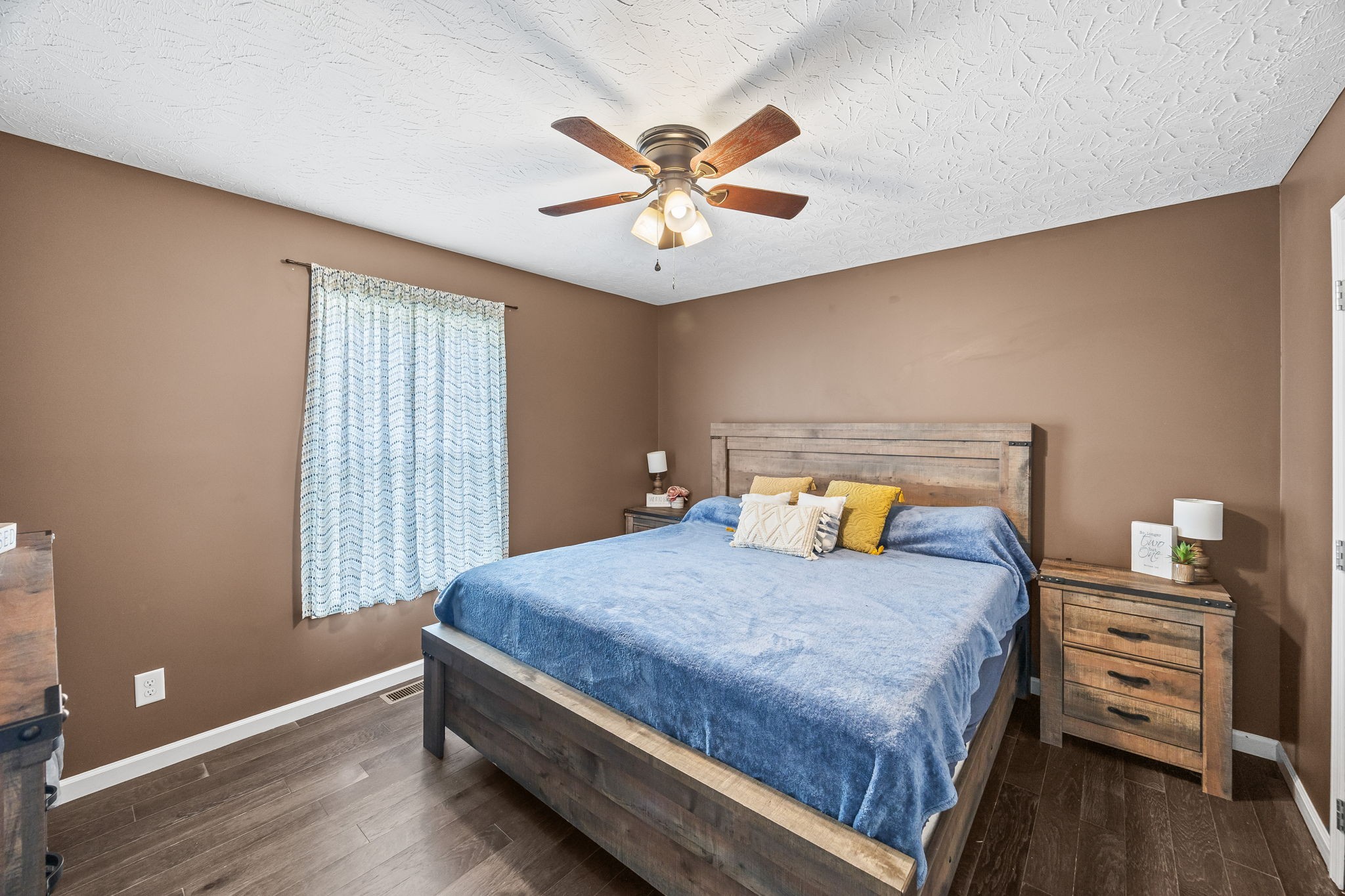 13723 Old Kentucky Road Walling, TN 38587 - Photo 9 of 34 a bedroom with a bed and a chandelier