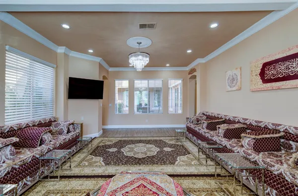 a living room with a couch and a flat screen tv