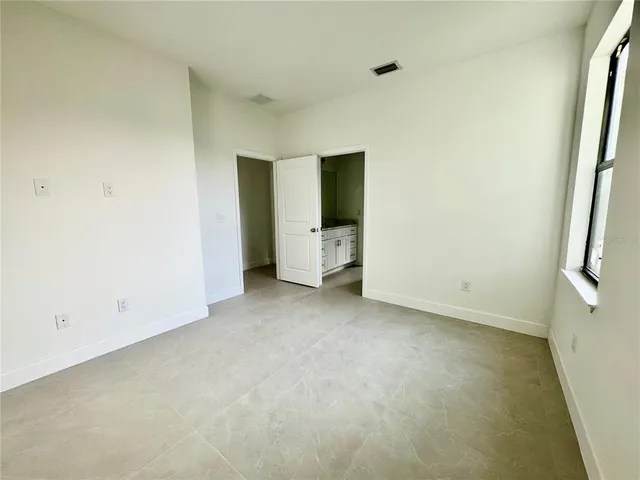 an empty room with a empty space and window