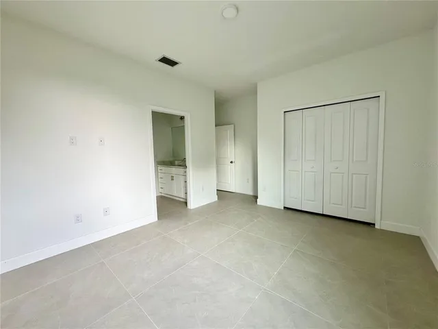 a bath room with a toilet a bath tub and a shower