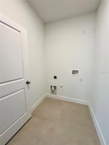 a view of a room with cabinet and windows