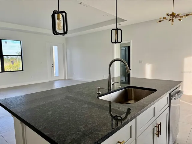 a kitchen with a faucet a sink and appliances