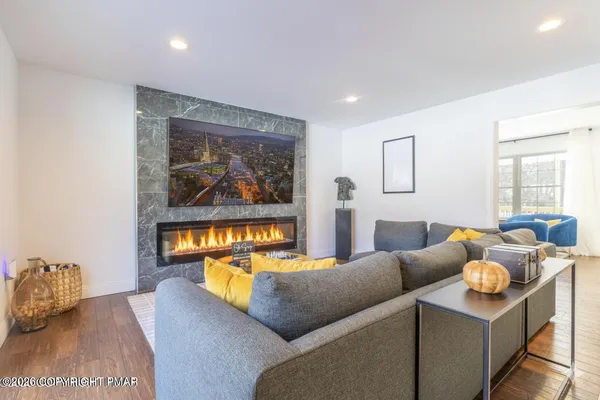 a living room with furniture and a window