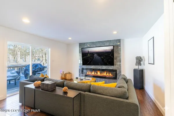 a living room with furniture and a flat screen tv