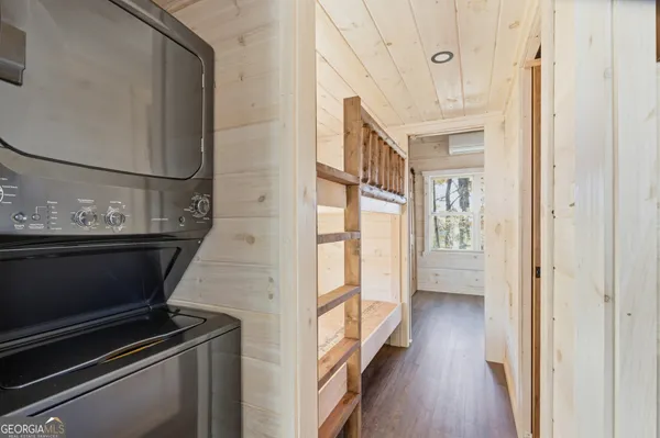 a view of an entryway with wooden floor