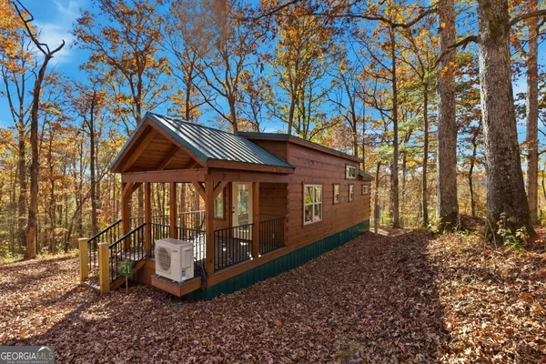 a view of outdoor space with wooden floor